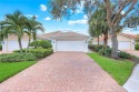 Immaculate Extended Capri Villa with Oversized Lakefront Lanai for sale in Naples Florida Collier County County on GolfHomes.com