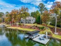 Experience the pinnacle of lakefront luxury with this for sale in Greensboro Georgia Greene County County on GolfHomes.com