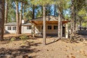 Escape to mountain bliss in this 3-bedroom, 2-bathroom retreat for sale in Pinetop Arizona Navajo County County on GolfHomes.com
