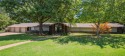 This exquisite, partially-wooded Mid Century Modern Ranch style for sale in Fayetteville Arkansas Washington County County on GolfHomes.com