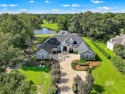 Exquisite Mediterranean design home on beautifully landscaped for sale in Fairhope Alabama Baldwin County County on GolfHomes.com