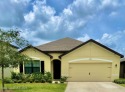 Enjoy beautiful golf course views from this spacious 4 bedroom 2 for sale in Mims Florida Brevard County County on GolfHomes.com