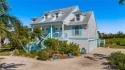 Nestled on a charming street in the Dunes, this impeccably for sale in Sanibel Florida Lee County County on GolfHomes.com