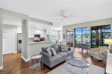 This lovely, first floor end unit coach home shows like new for sale in Estero Florida Lee County County on GolfHomes.com