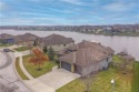 Dream home on the water at Highly sought after Creek Moor Lake & for sale in Raymore Missouri Cass County County on GolfHomes.com
