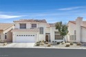 Two story beauty in guard gated Painted Desert golf community for sale in Las Vegas Nevada Clark County County on GolfHomes.com