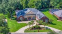 Step into elevated living in this custom-built pool home for sale in Pace Florida Santa Rosa County County on GolfHomes.com