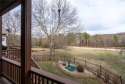 Beautiful view off the back deck with this 3 bed 2 bath 2876 Sq for sale in Bella Vista Arkansas Benton County County on GolfHomes.com
