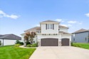 This beautiful two-story home backs up to hole number 16 on the for sale in Raymore Missouri Cass County County on GolfHomes.com