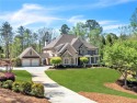 This exquisite custom manor thoughtfully situated on 2+ for sale in Alpharetta Georgia Cherokee County County on GolfHomes.com