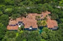 This sprawling Mediterranean Estate sits on 1.25 acres in the for sale in Jupiter Florida Palm Beach County County on GolfHomes.com