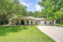 ENCHANTING 3-3-2 home nestled on a beautiful 1+ acre riverfront for sale in Granbury Texas Hood County County on GolfHomes.com