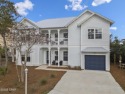 Presenting an exquisite 3-bedroom, 3-bathroom New Orleans-style for sale in Panama City Beach Florida Bay County County on GolfHomes.com