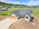 Discover unparalleled luxury in this stunning new construction for sale in Spearfish South Dakota Lawrence County County on GolfHomes.com