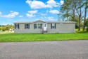 Welcome to this stunning modern Double-Wide Modular Home for sale in Brooksville Florida Hernando County County on GolfHomes.com