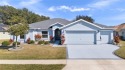 This gorgeous 3-bedroom home with a Den/Office sits on a large 9 for sale in Leesburg Florida Lake County County on GolfHomes.com