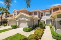 FIRST FLOOR END UNIT WITH SPECTACULAR GOLF COURSE AND LAKE VIEWS for sale in Estero Florida Lee County County on GolfHomes.com