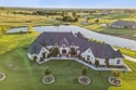 Experience refined living in this breathtaking custom estate set for sale in Weatherford Texas Parker County County on GolfHomes.com