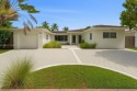Beautiful light and bright pool home in a gated residential golf for sale in Miami Beach Florida Miami-Dade County County on GolfHomes.com