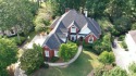 This 4-sided brick beauty with 3 car side entry garage features for sale in Cumming Georgia Forsyth County County on GolfHomes.com