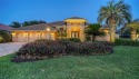 This custom Pruett home is located on a premier lake and golf for sale in Lakewood Ranch Florida Manatee County County on GolfHomes.com