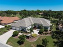 Discover refined living in this expansive Calusa Lakes estate for sale in Nokomis Florida Sarasota County County on GolfHomes.com