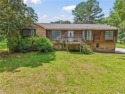 Located on a large lot beside the golf course, this home offers for sale in Pinson Alabama Jefferson County County on GolfHomes.com