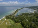 Enjoying panoramic views of Lake Michigan and Bay Harbor Lake for sale in Bay Harbor Michigan Emmet County County on GolfHomes.com