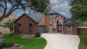 STUNNING 2-STORY RETREAT BACKING TO GREENBELT & POND VIEWS!
 for sale in Rowlett Texas Dallas County County on GolfHomes.com