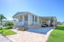 Located in Naples Estates, a 55+ community, this breathtaking for sale in Naples Florida Collier County County on GolfHomes.com