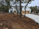 Energy efficient 4 bedroom 2 bathroom one and a half story, with for sale in Runaway Bay Texas Wise County County on GolfHomes.com