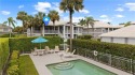 Beautiful long views of golf and tee box from your screened for sale in Naples Florida Collier County County on GolfHomes.com
