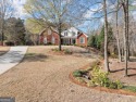 Freshly painted inside & out, newer roof, updated landscaping, & for sale in Flowery Branch Georgia Hall County County on GolfHomes.com