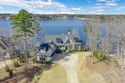 Discover luxurious lakefront living at its finest with this for sale in Greensboro Georgia Greene County County on GolfHomes.com