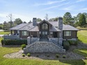 Lakefront Villa with Max Dock in Cuscowilla.  Enjoy spectacular for sale in Eatonton Georgia Putnam County County on GolfHomes.com