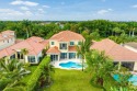 This exceptional six-bedroom estate is nestled on an oversized for sale in Wellington Florida Palm Beach County County on GolfHomes.com