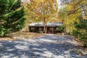 Tucked away in the woods of Massanutten, this beautiful home for sale in Mcgaheysville Virginia Rockingham County County on GolfHomes.com