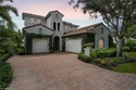 Experience unparalleled luxury in this elegant Villa D'Este for sale in Miromar Lakes Florida Lee County County on GolfHomes.com