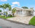 Discover your dream home in this beautifully renovated 3 bedroom for sale in Davie Florida Broward County County on GolfHomes.com