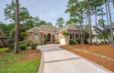 A home built for comfort and entertaining awaits you.  The front for sale in Ocean Isle Beach North Carolina Brunswick County County on GolfHomes.com