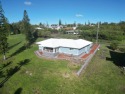 This 2022 beauty near the 18th tee with ocean and fairway views for sale in Naalehu Hawaii Big Island County County on GolfHomes.com