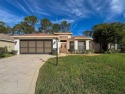 PRICE REDUCTION! Nestled within the highly sought-after gated for sale in New Port Richey Florida Pasco County County on GolfHomes.com