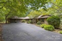 Exceptional home nestled on 1 acre of picturesque grounds with for sale in Flat Rock North Carolina Henderson County County on GolfHomes.com