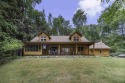 Welcome to 4708 Lake Road, a stunning custom built log home for sale in Harbor Springs Michigan Emmet County County on GolfHomes.com