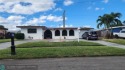 Charming 4-Bed, 3-Bath updated home in the highly sought-after for sale in Plantation Florida Broward County County on GolfHomes.com