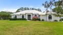 Situated on 2 beautifully landscaped acres in Stuart for sale in Palm City Florida Martin County County on GolfHomes.com