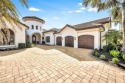 This exquisite custom estate welcomes you with sweeping southern for sale in Naples Florida Collier County County on GolfHomes.com