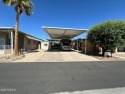 This spacious RV lot offers a 14'6'' wide open space, perfect for sale in Surprise Arizona Maricopa County County on GolfHomes.com
