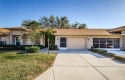 Welcome Timber Greens, a premier 55+ gated golf community. This for sale in New Port Richey Florida Pasco County County on GolfHomes.com