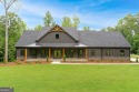 nWelcome to this stunning Craftsman home nestled on a beautiful for sale in Forsyth Georgia Monroe County County on GolfHomes.com